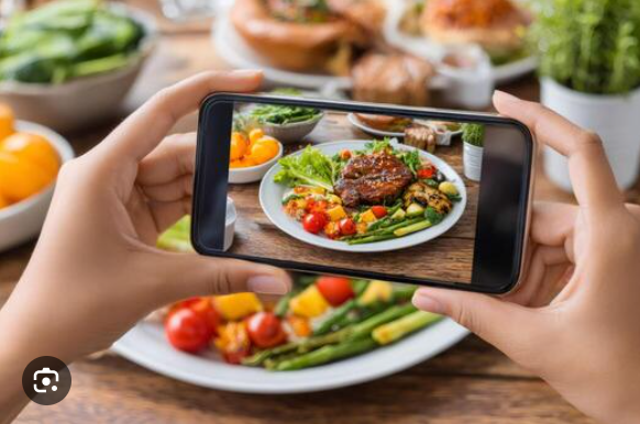 taking photo of food plate